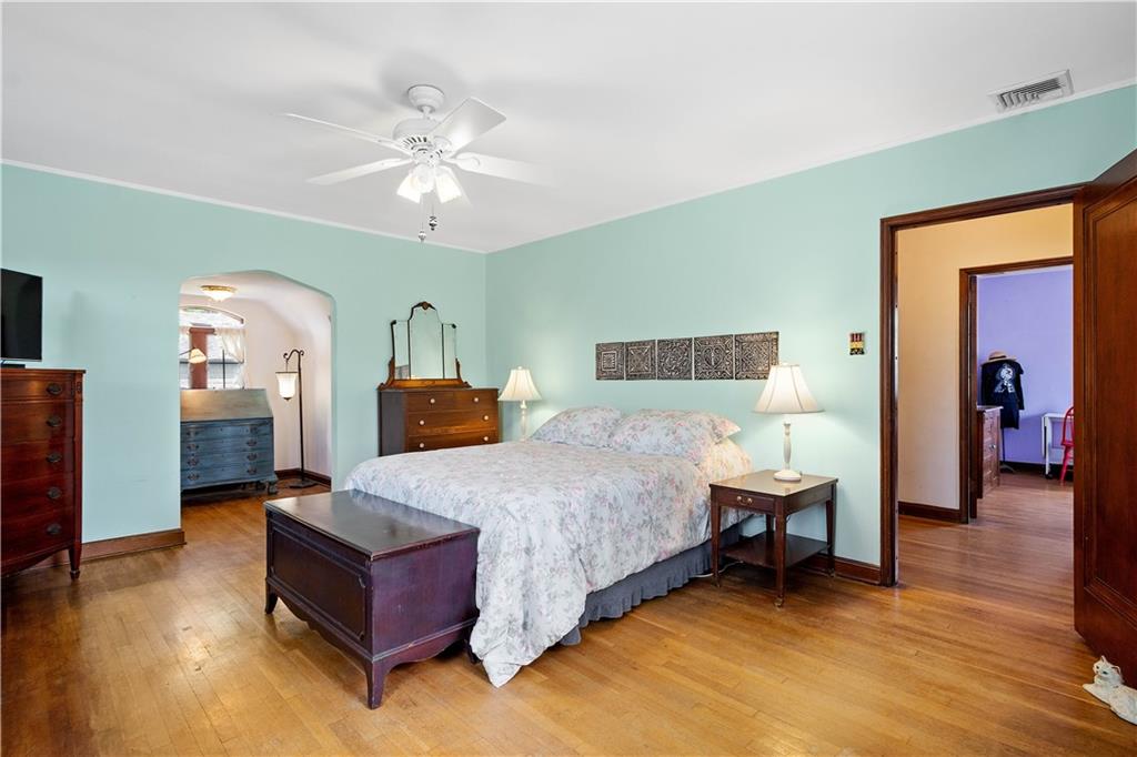 2 Crescent Drive Pittsburgh, PA 15228 - Photo 20 of 48 a spacious bedroom with a bed and a chandelier