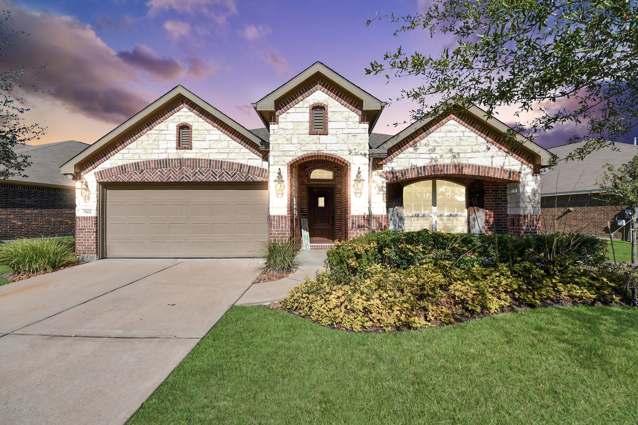 7502 Simpson Springs Lane Spring, TX 77389 - Photo 1 of 38 a front view of a house with a garden and plants