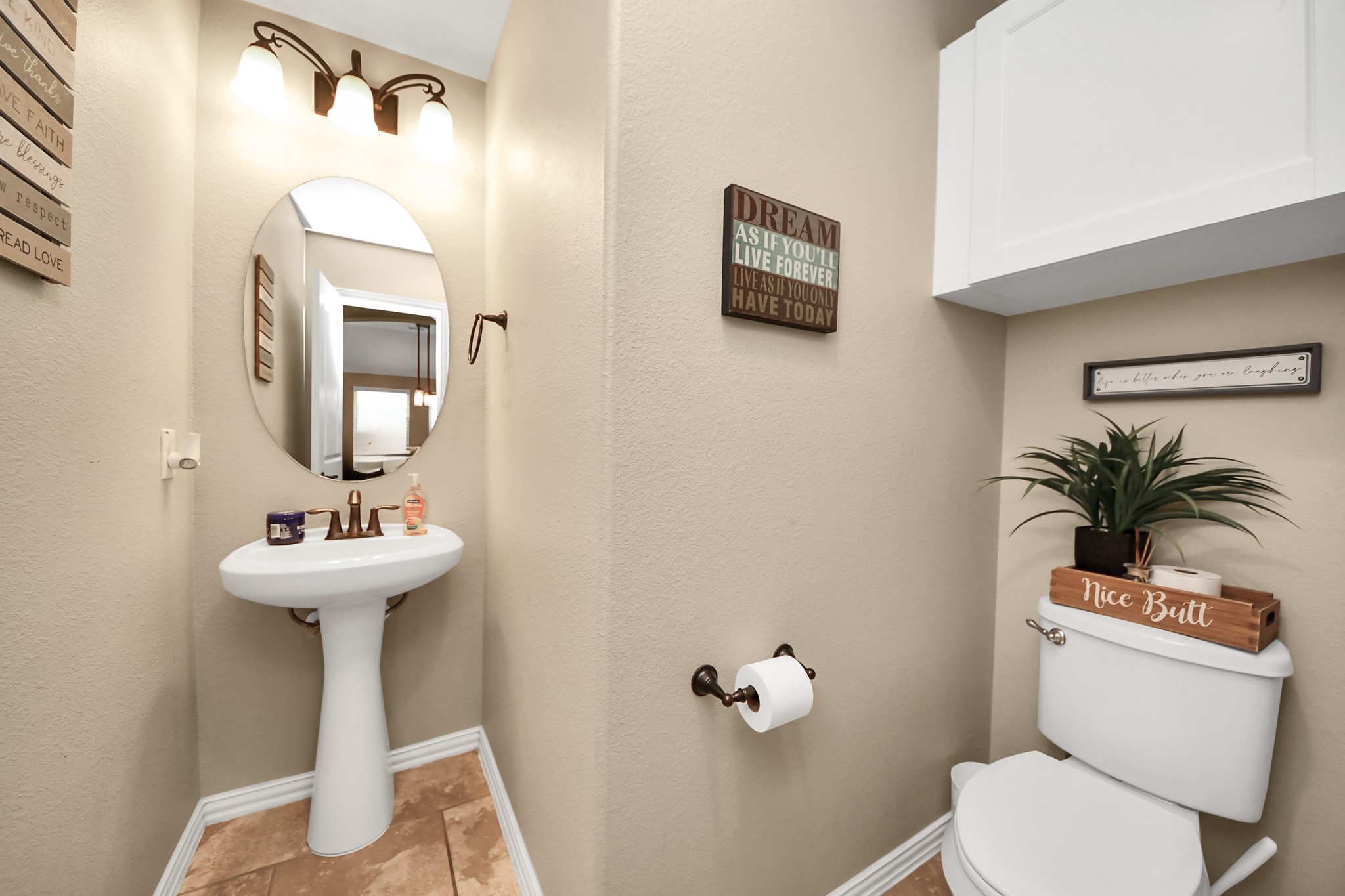 7502 Simpson Springs Lane Spring, TX 77389 - Photo 17 of 38 a bathroom with a toilet sink and mirror