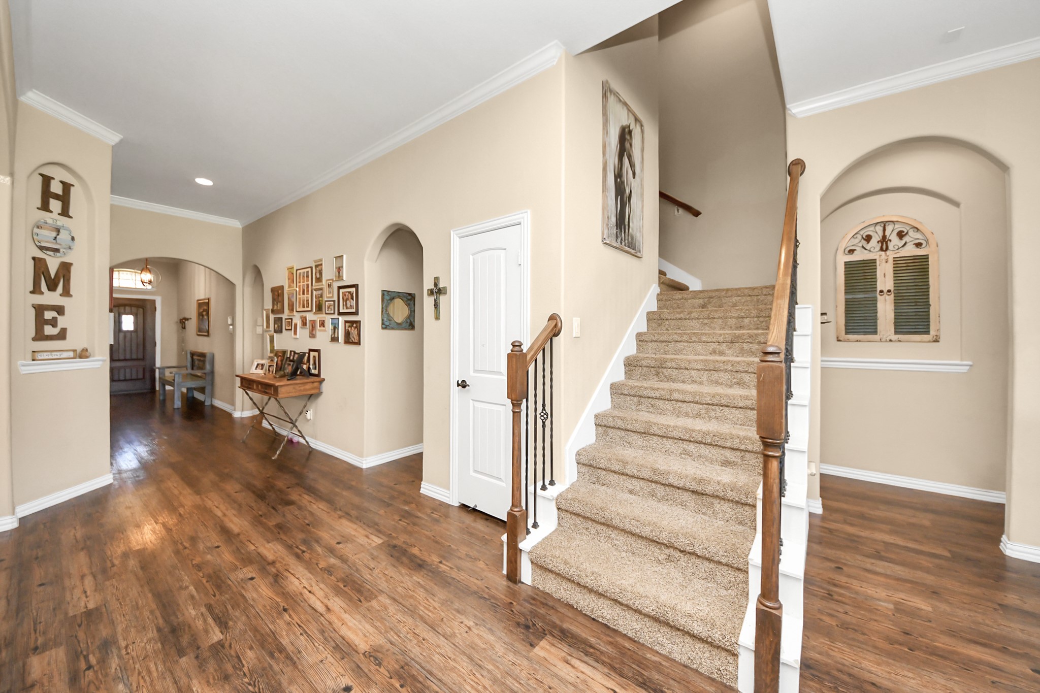 7502 Simpson Springs Lane Spring, TX 77389 - Photo 18 of 38 a view of entryway with wooden floor and stairs