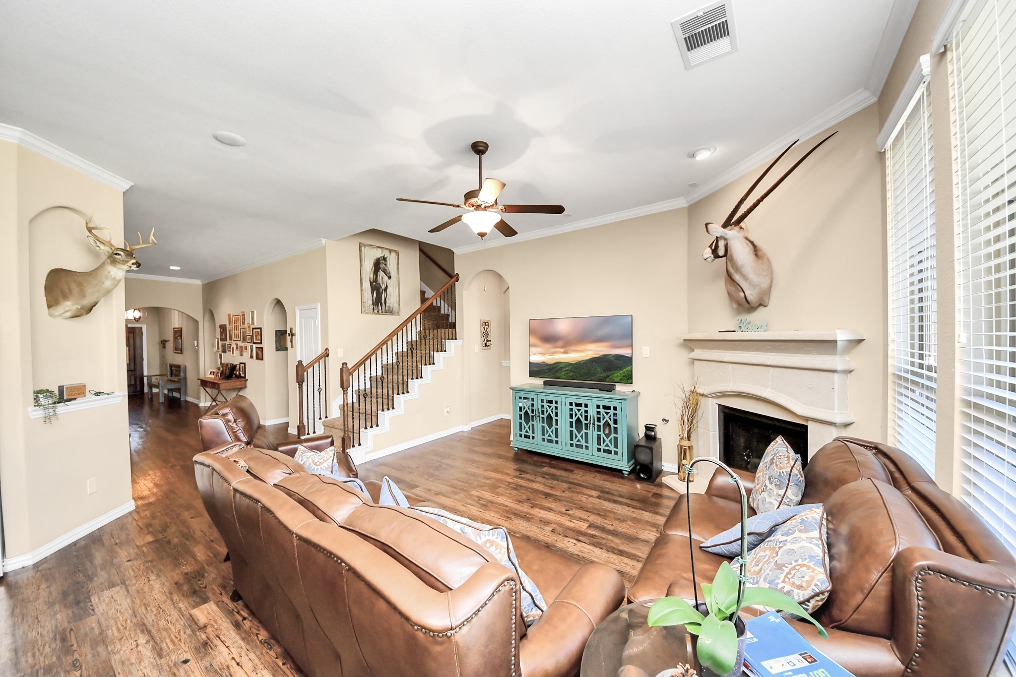 7502 Simpson Springs Lane Spring, TX 77389 - Photo 19 of 38 a living room with furniture and a fireplace