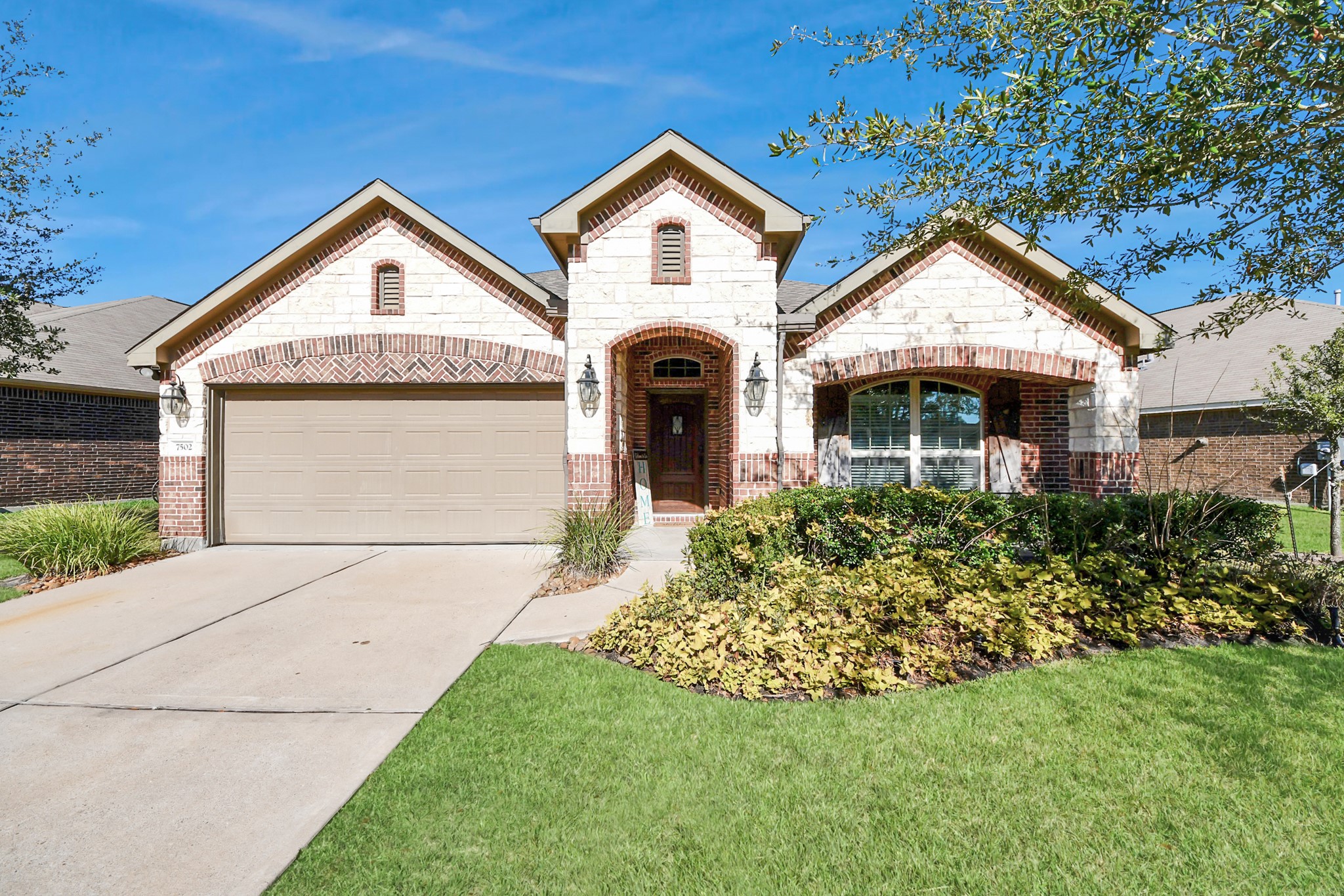 7502 Simpson Springs Lane Spring, TX 77389 - Photo 2 of 38 a front view of a house with garden