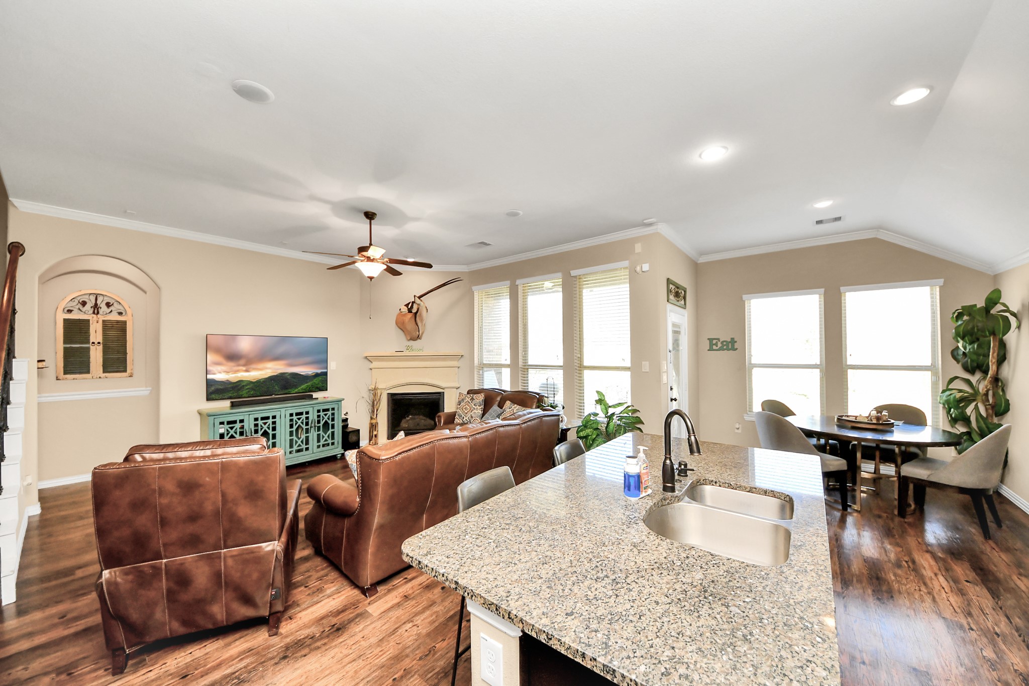 7502 Simpson Springs Lane Spring, TX 77389 - Photo 26 of 38 a living room with furniture a fireplace and a table