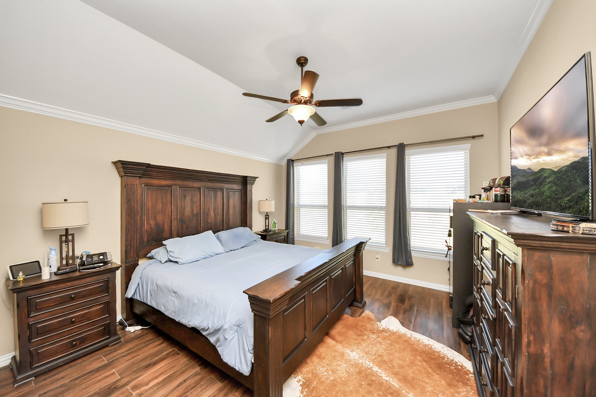 7502 Simpson Springs Lane Spring, TX 77389 - Photo 31 of 38 a bed room with a bed and a chandelier