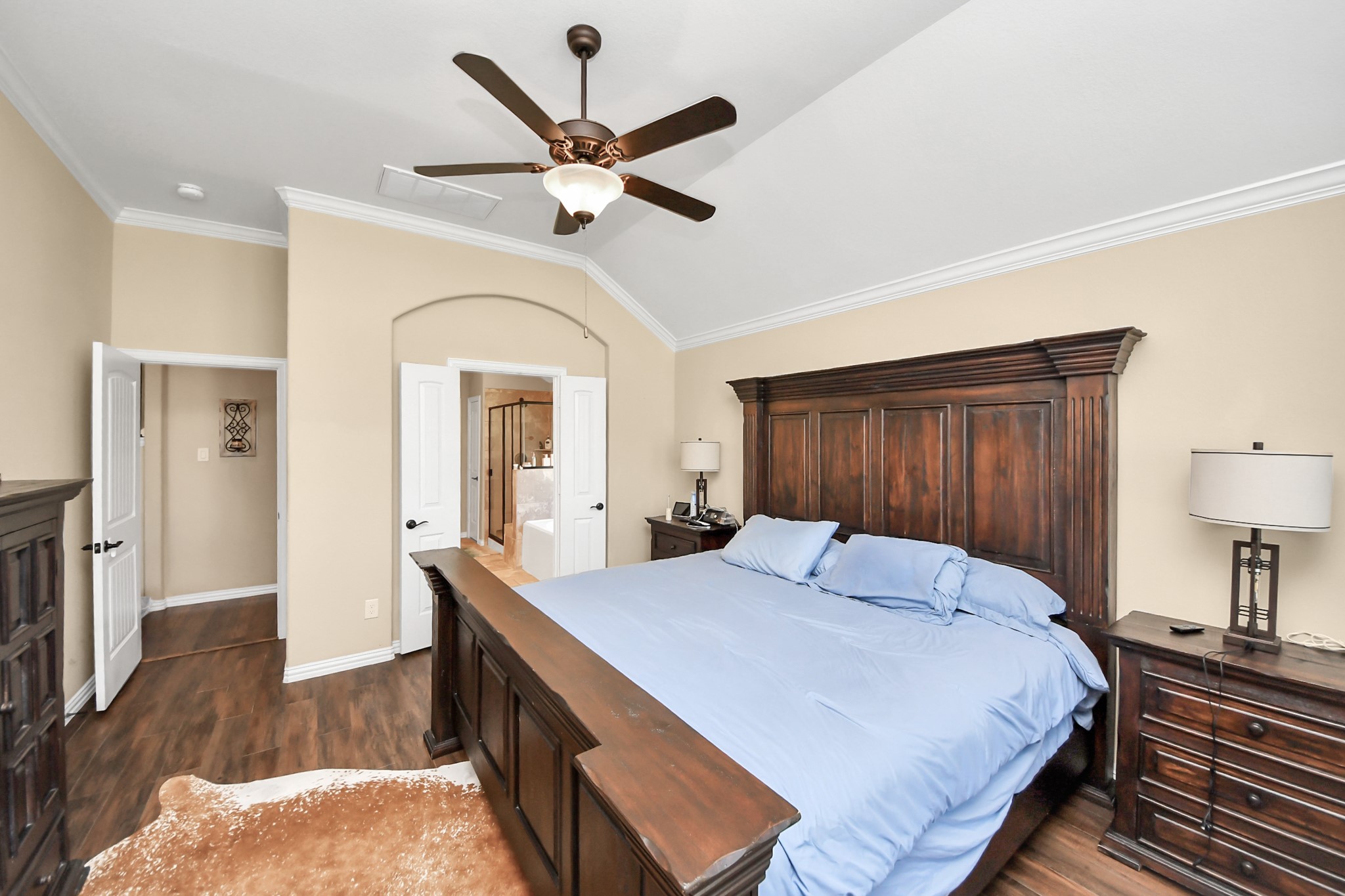 7502 Simpson Springs Lane Spring, TX 77389 - Photo 32 of 38 a bed room with a bed and a chandelier