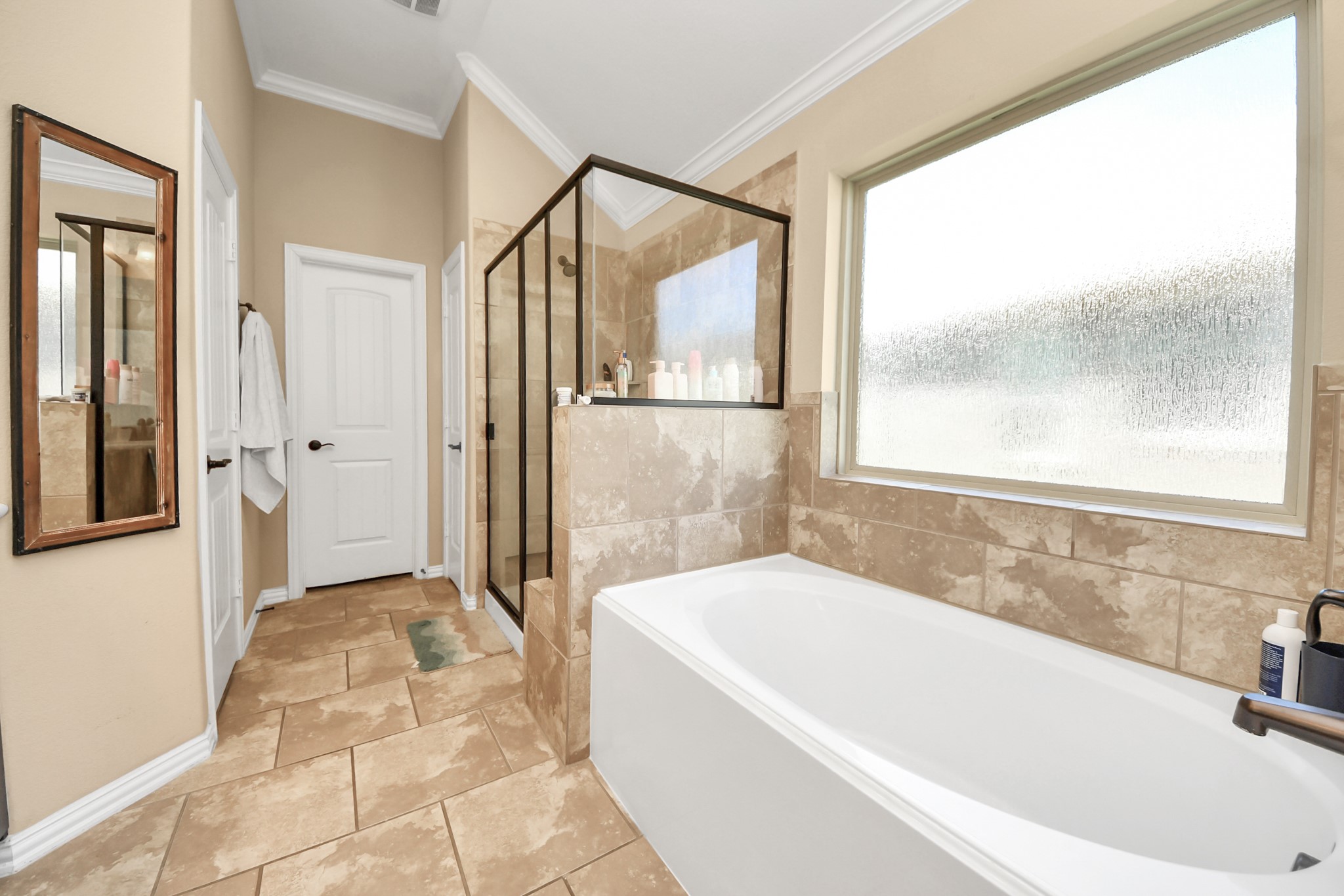 7502 Simpson Springs Lane Spring, TX 77389 - Photo 34 of 38 a bathroom with a bathtub and a shower
