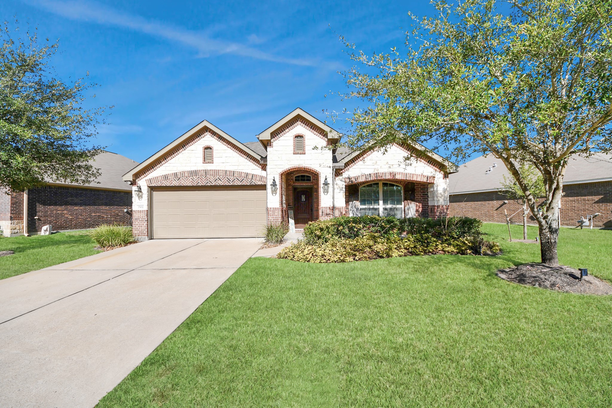 7502 Simpson Springs Lane Spring, TX 77389 - Photo 6 of 38 a front view of a house with a yard and garage