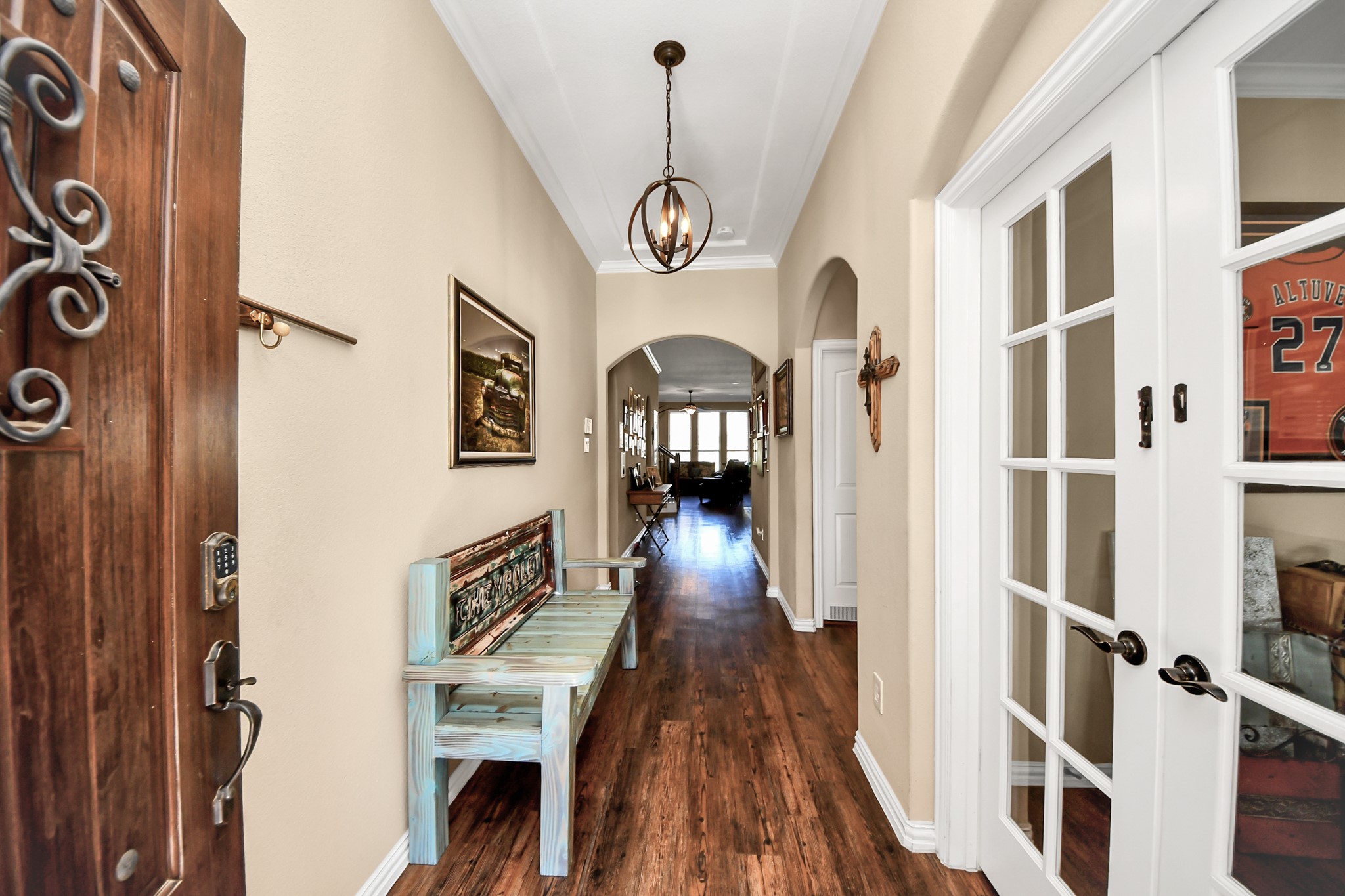 7502 Simpson Springs Lane Spring, TX 77389 - Photo 9 of 38 a view of a hallway with wooden floor and staircase