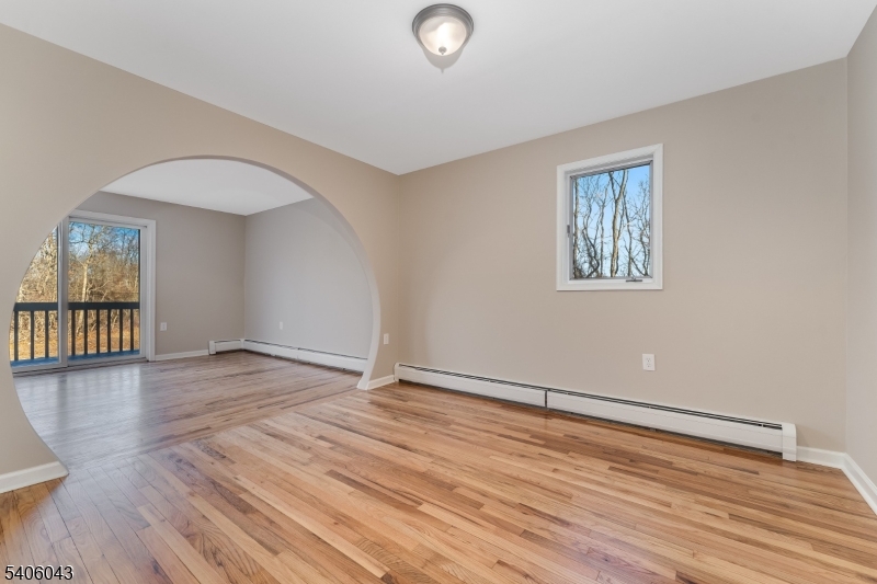 333 Mt Bethel Road Port Murray, NJ 07865 - Photo 11 of 47 a view of an empty room with wooden floor and a window