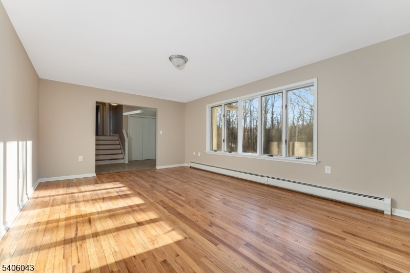 333 Mt Bethel Road Port Murray, NJ 07865 - Photo 13 of 47 a view of an empty room with wooden floor and a window