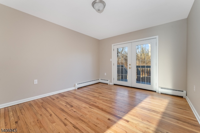 333 Mt Bethel Road Port Murray, NJ 07865 - Photo 15 of 47 a view of an empty room with wooden floor and a window