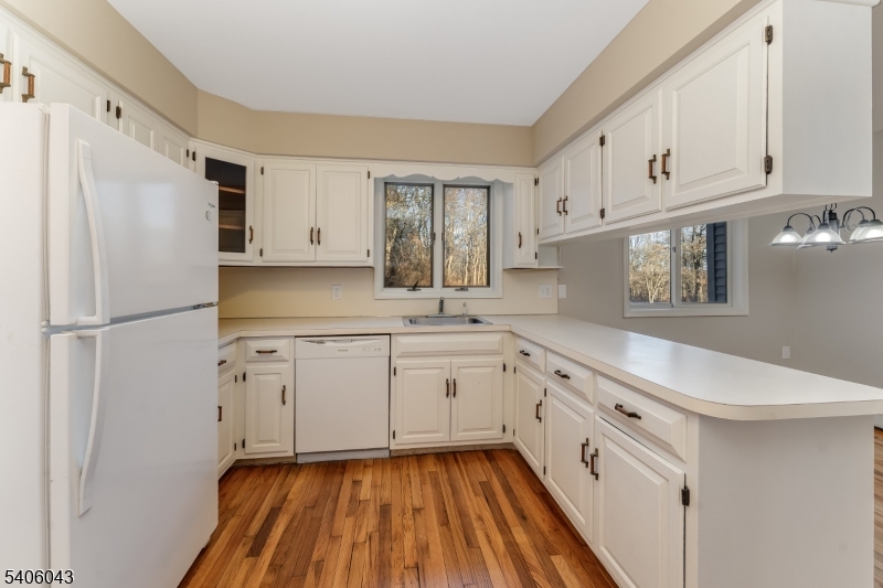 333 Mt Bethel Road Port Murray, NJ 07865 - Photo 16 of 47 a kitchen with granite countertop white cabinets and white appliances
