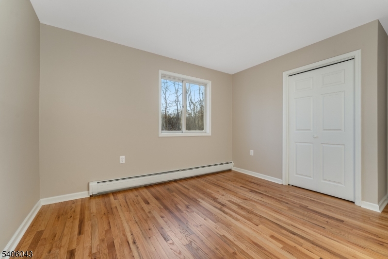 333 Mt Bethel Road Port Murray, NJ 07865 - Photo 25 of 47 an empty room with wooden floor and windows