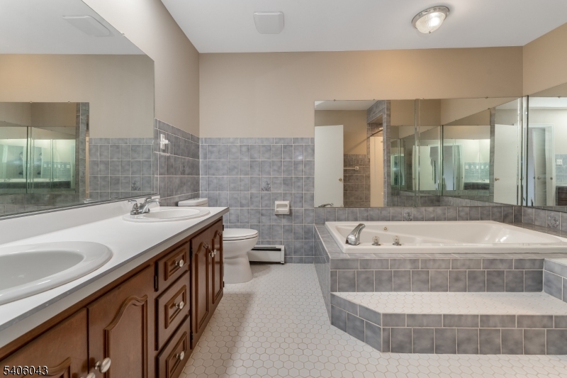 333 Mt Bethel Road Port Murray, NJ 07865 - Photo 28 of 47 a spacious bathroom with a tub sink and mirror