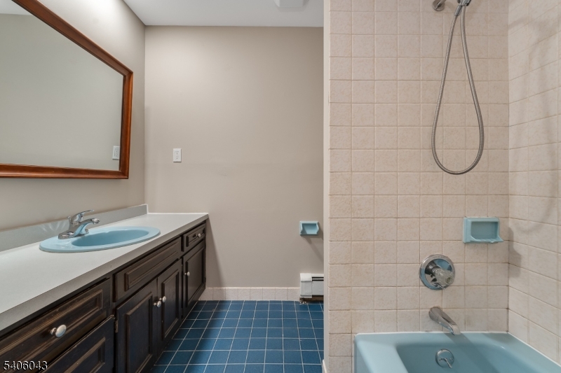 333 Mt Bethel Road Port Murray, NJ 07865 - Photo 29 of 47 a bathroom with a sink a vanity and a shower