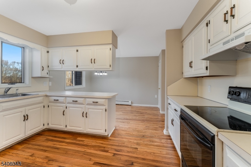333 Mt Bethel Road Port Murray, NJ 07865 - Photo 4 of 47 a kitchen with granite countertop white cabinets and white appliances