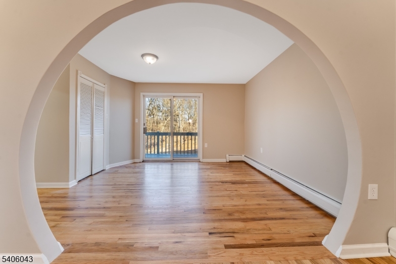 333 Mt Bethel Road Port Murray, NJ 07865 - Photo 5 of 47 a view of an empty room with wooden floor and a window