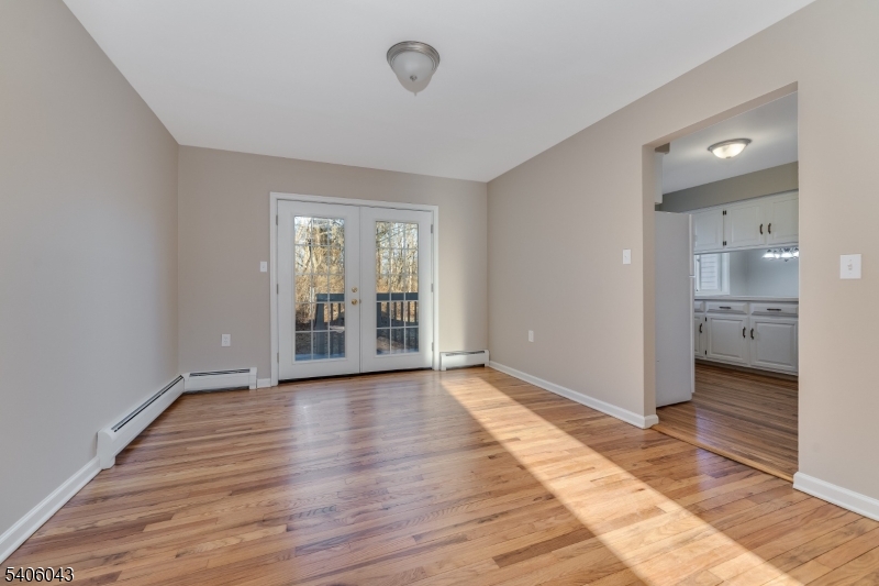 333 Mt Bethel Road Port Murray, NJ 07865 - Photo 6 of 47 a view of an empty room and window and wooden floor