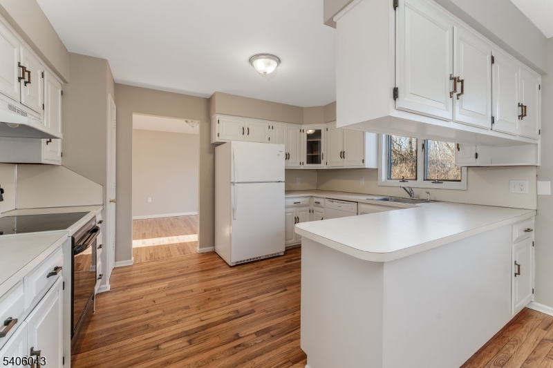333 Mt Bethel Road Port Murray, NJ 07865 - Photo 8 of 47 a kitchen with a sink white cabinets and stainless steel appliances