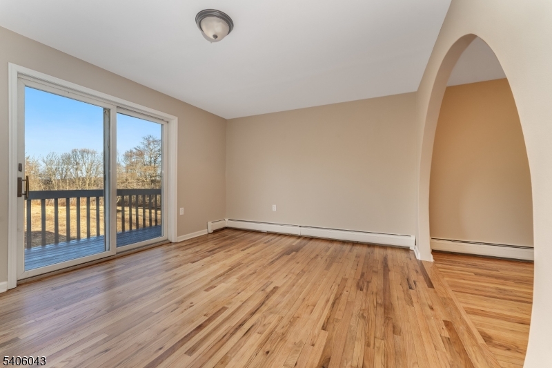 333 Mt Bethel Road Port Murray, NJ 07865 - Photo 9 of 47 a view of an empty room with wooden floor and a window