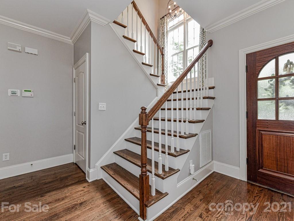821 Millbrook Road Charlotte, NC 28211 - Photo 22 of 40 a view of entryway with wooden floor and stairs