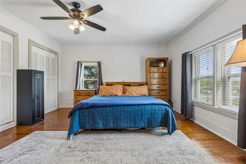 a bedroom with a large bed and a window
