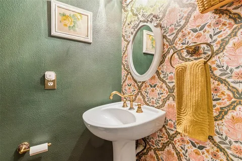 a bathroom with a sink and mirror