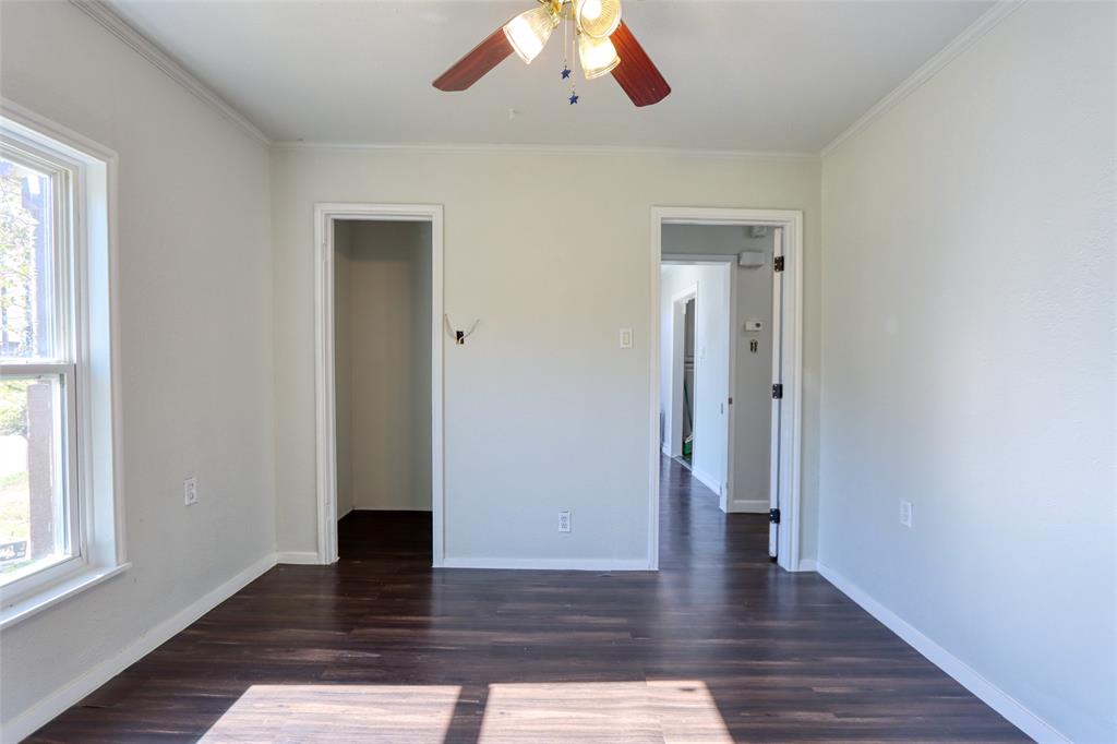 2222 Houston Street Grand Prairie, TX 75050 - Photo 15 of 24 a view of a hallway with wooden floor and windows