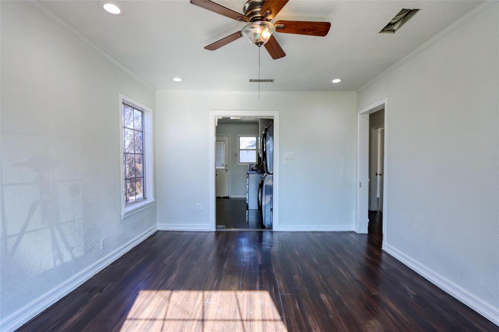2222 Houston Street Grand Prairie, TX 75050 - Photo 2 of 24 a view of empty room with wooden floor