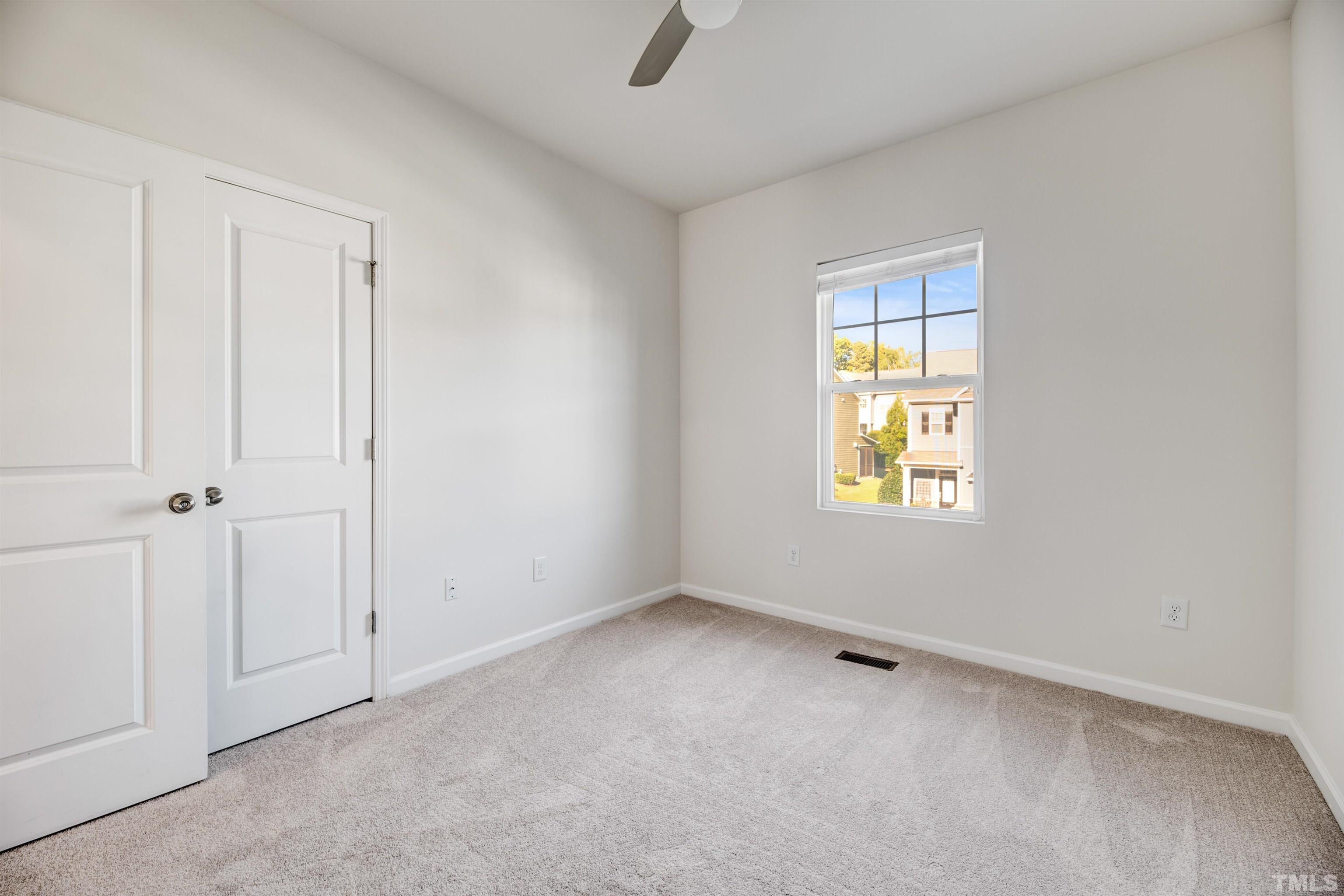 714 Treviso Lane Apex, NC 27502 - Photo 21 of 41 an empty room with windows