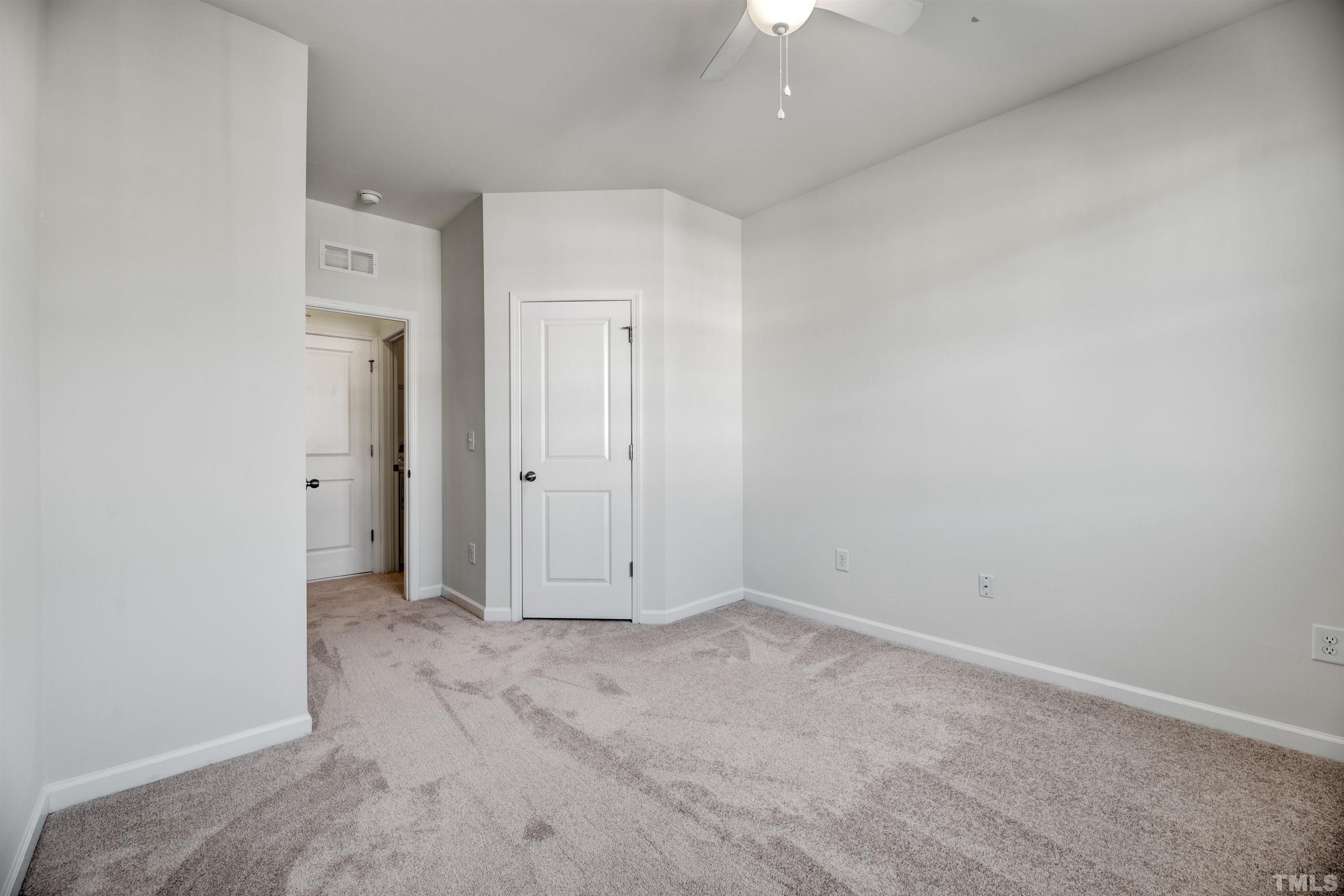 714 Treviso Lane Apex, NC 27502 - Photo 22 of 41 an empty room with an entryway