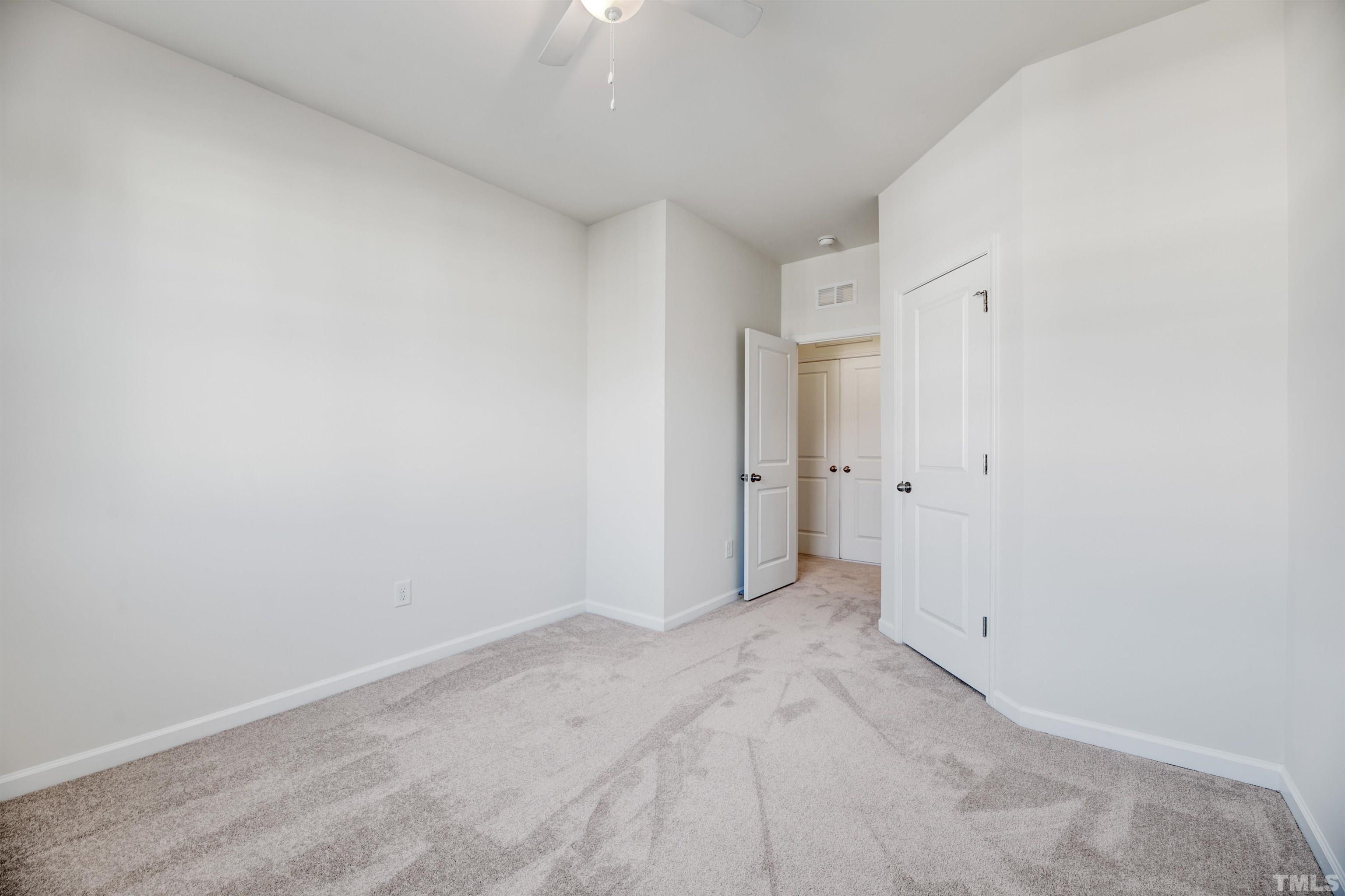 714 Treviso Lane Apex, NC 27502 - Photo 23 of 41 a view of an empty room