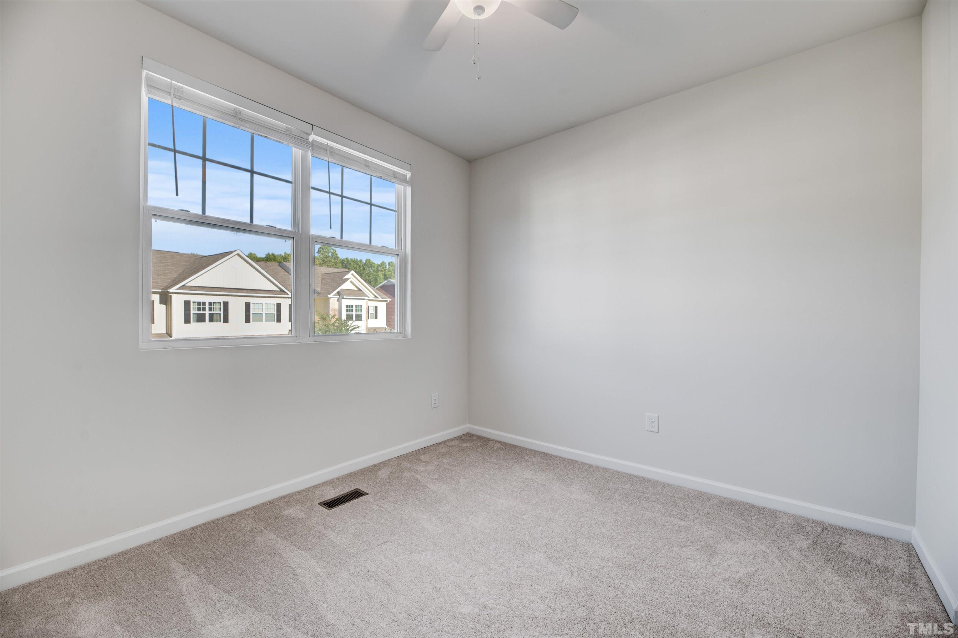 714 Treviso Lane Apex, NC 27502 - Photo 24 of 41 an empty room with a window