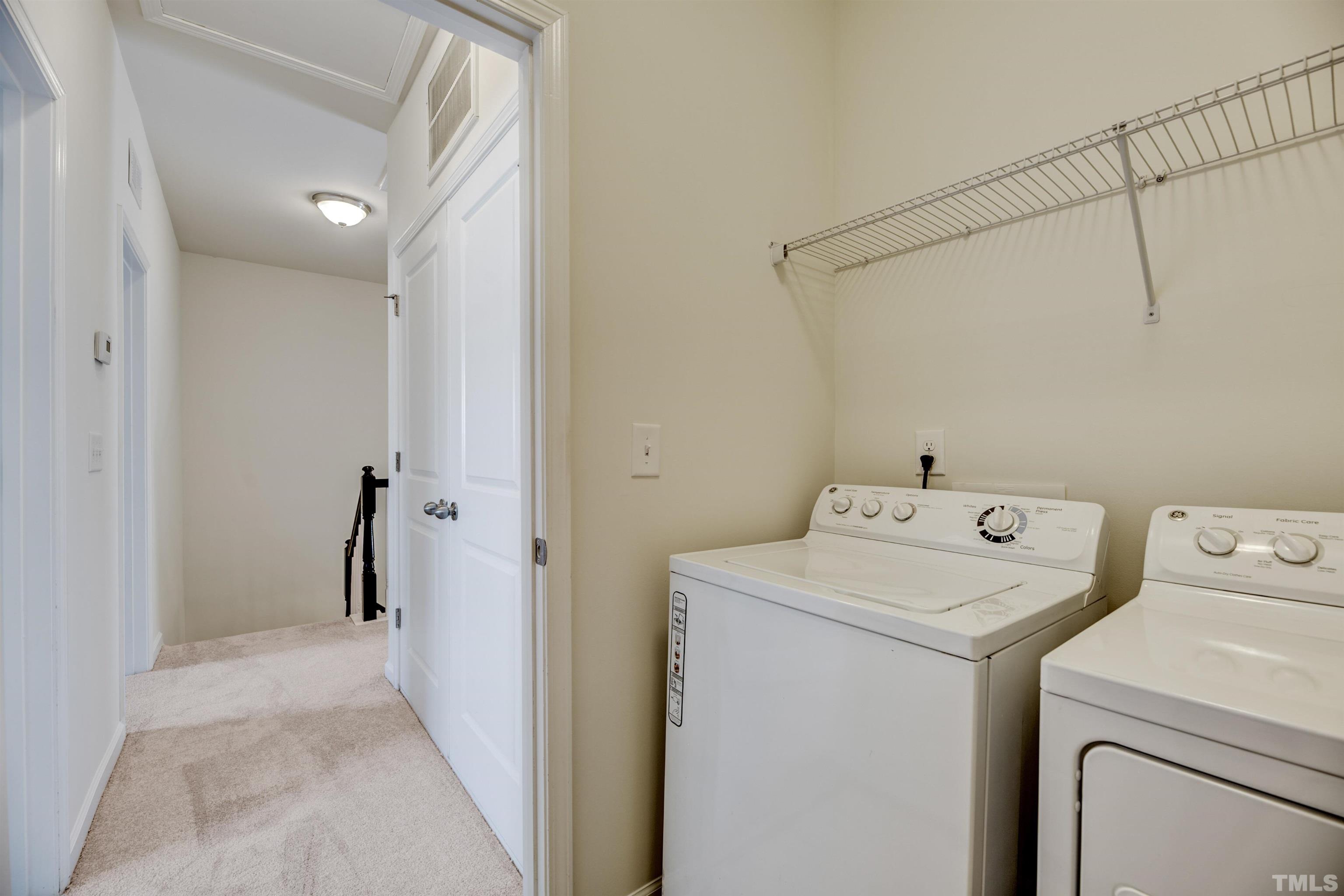 714 Treviso Lane Apex, NC 27502 - Photo 25 of 41 a utility room with dryer and washer