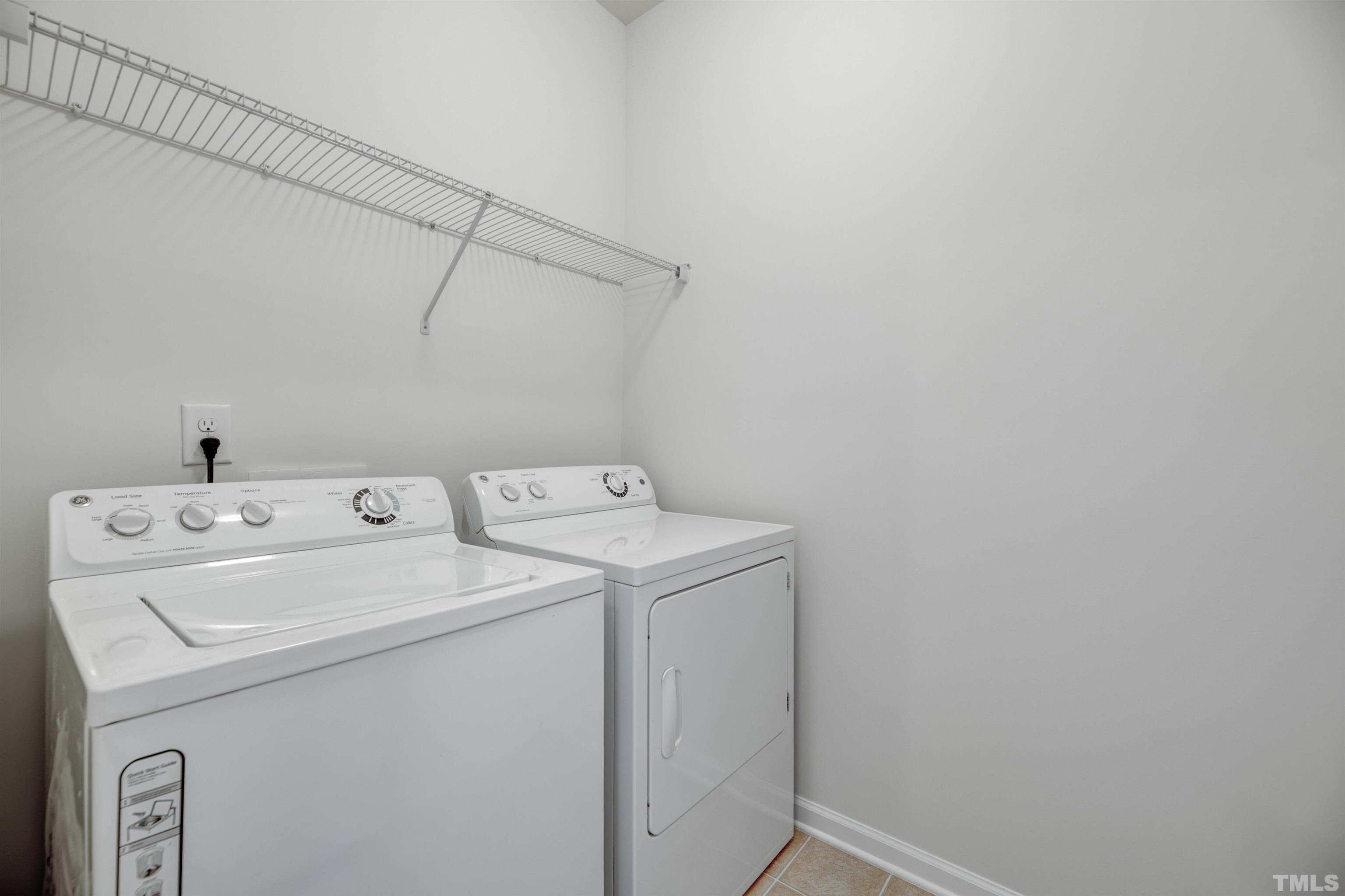 714 Treviso Lane Apex, NC 27502 - Photo 26 of 41 a utility room with dryer and washer