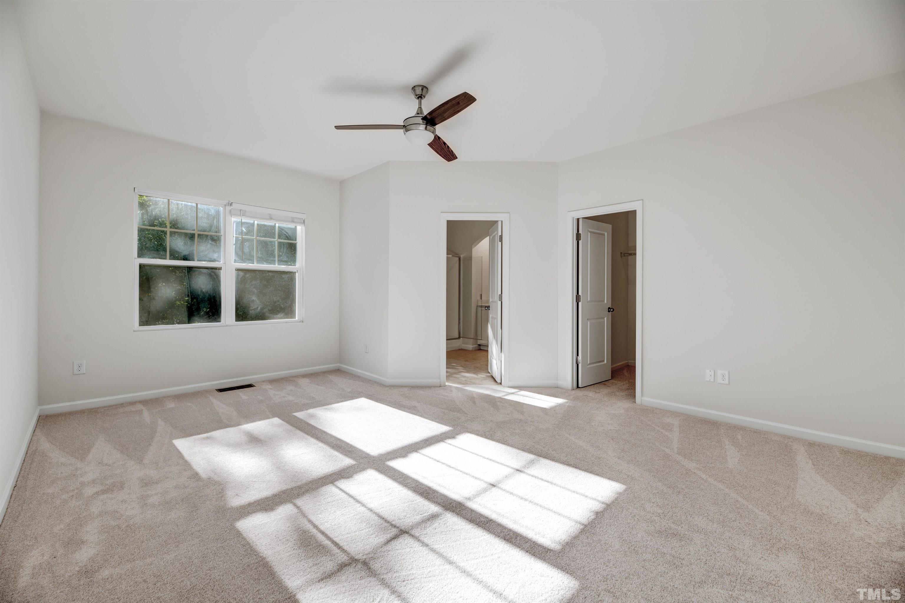714 Treviso Lane Apex, NC 27502 - Photo 28 of 41 a view of an empty room with a window