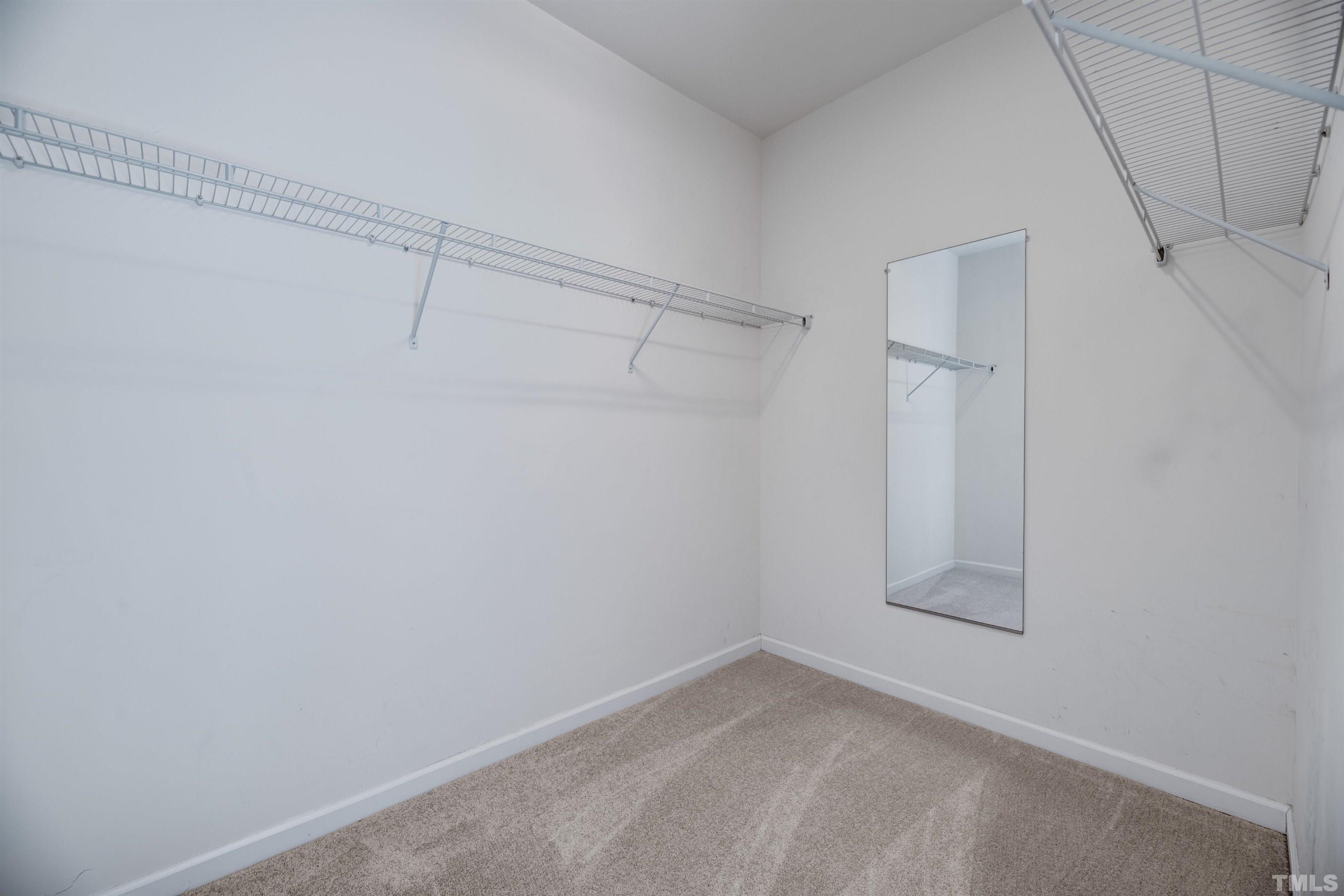 714 Treviso Lane Apex, NC 27502 - Photo 30 of 41 a view of a room with racks on the wall