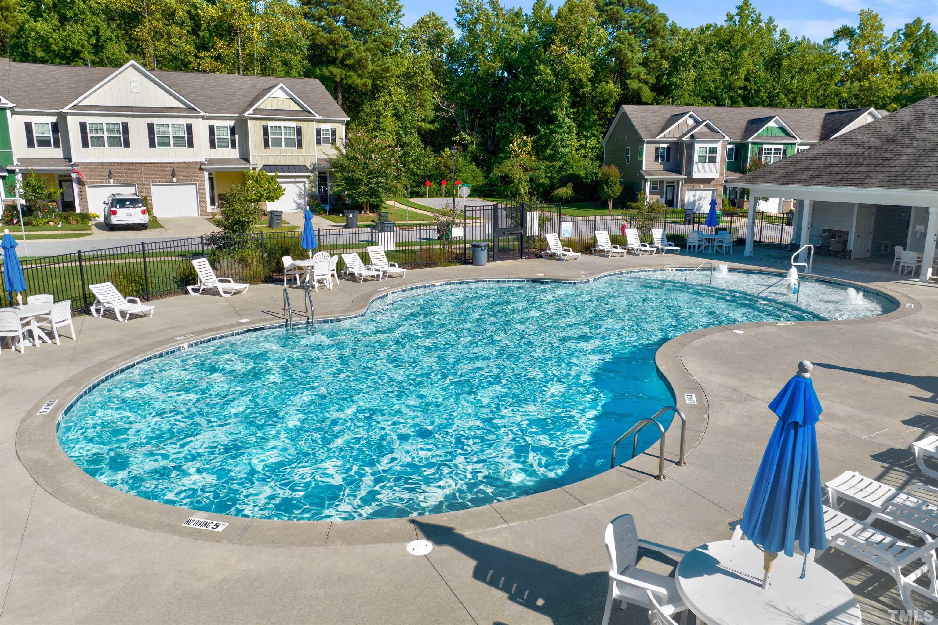 714 Treviso Lane Apex, NC 27502 - Photo 38 of 41 a view of a house with backyard porch and sitting area