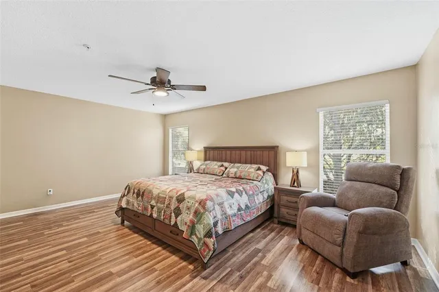 a bedroom with a bed couch and window