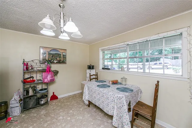 a bed room with a bed mirror and a window