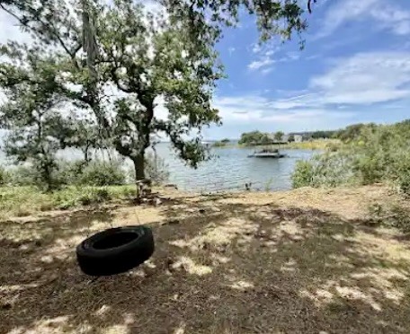 4215 Sunset Cliff Road Burnet, TX 78611 - Photo 6 of 13 A tranquil lakeside retreat with mature trees and direct water access.