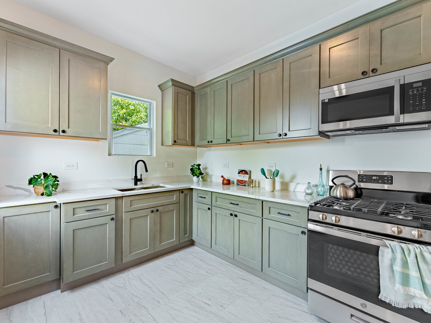 2343 Ridgeland Avenue Berwyn, IL 60402 - Photo 11 of 30 a kitchen with stainless steel appliances granite countertop a sink and stove top oven
