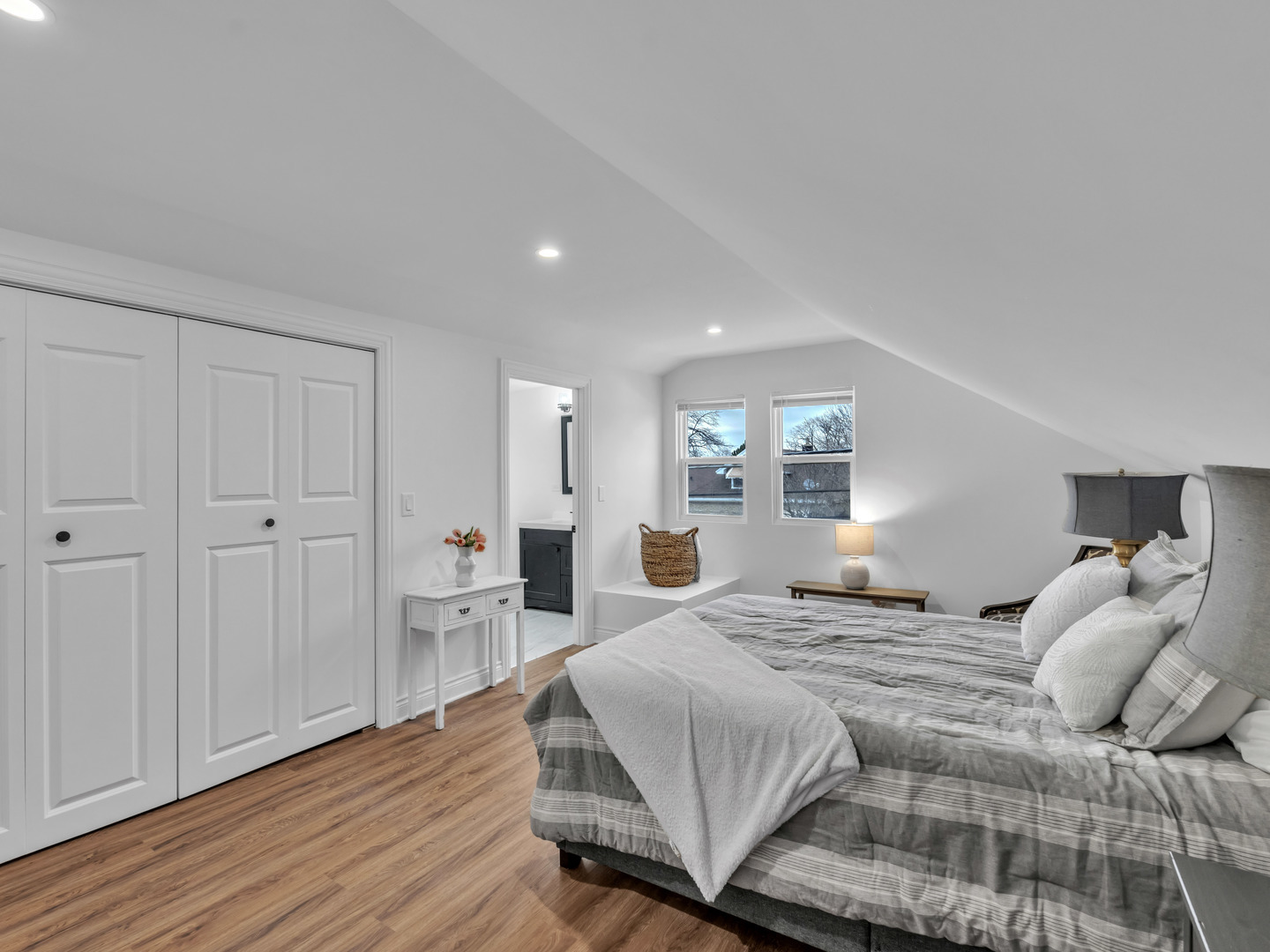 2343 Ridgeland Avenue Berwyn, IL 60402 - Photo 18 of 30 a bedroom with a large bed and wooden floor