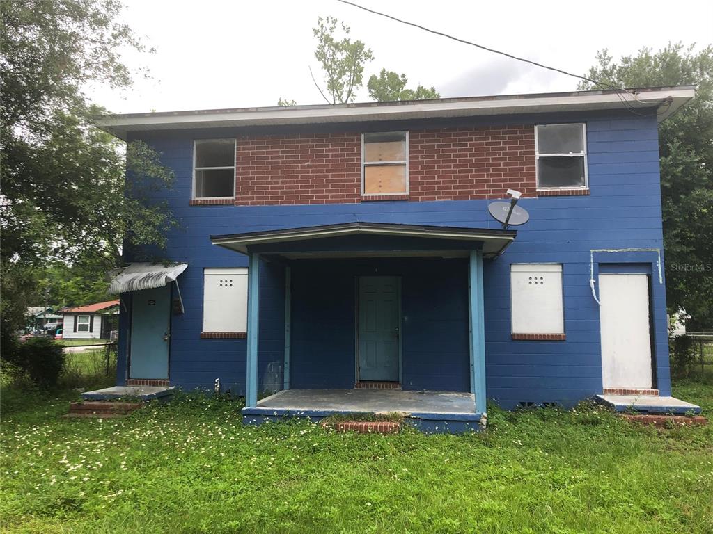 1781 West 3rd Street Jacksonville, FL 32209 - Photo 1 of 1 a front view of a house with a yard
