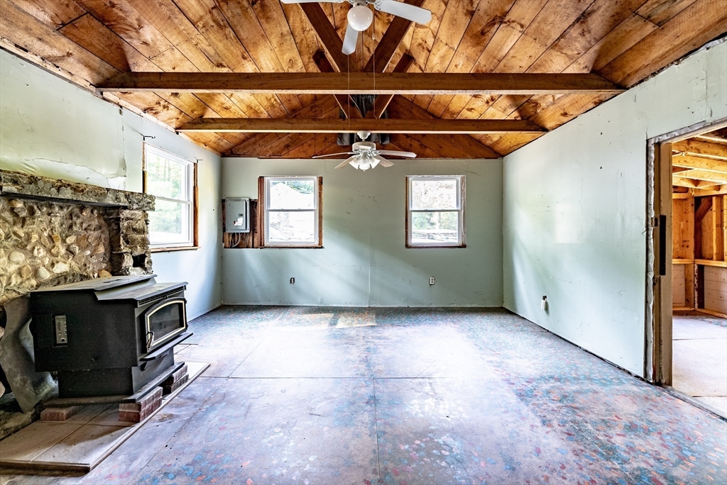 137 Rainbow Road Otis, MA 01029 - Photo 7 of 31 a view of a livingroom with a fireplace