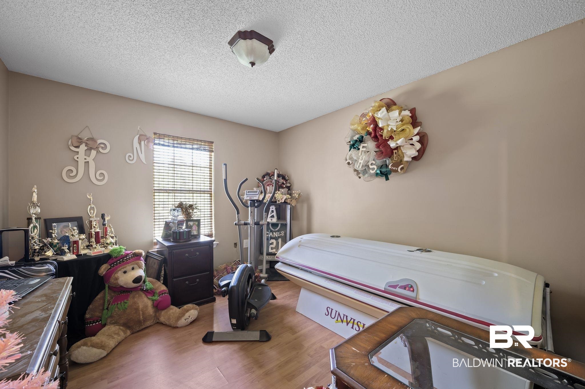 52923 Ammons Road Perdido, AL 36562 - Photo 20 of 35 Bedroom featuring wood finished floors and a textured ceiling
