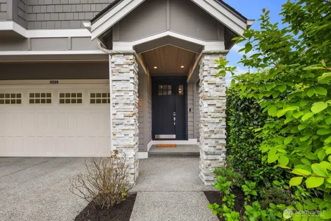 a front view of a house with a garage