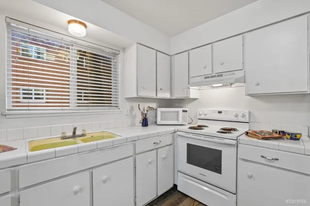 wooden floor with white walls