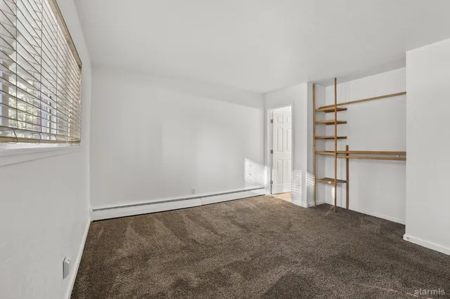 a bathroom with a sink vanity and a mirror