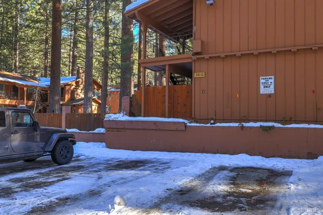 an empty room with furniture and fireplace